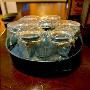 Set of seven glass jars with metallic tray
